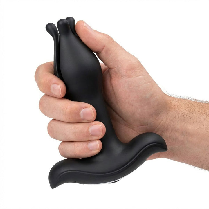 Plug anal extensible Teazers tenu en main